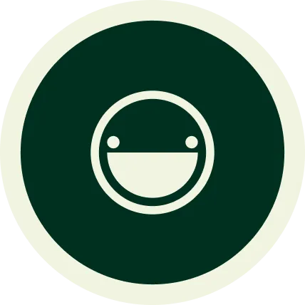Smiley face icon with wide open mouth and two round eyes, enclosed in a dark green circle with a cream-colored scalloped edge.